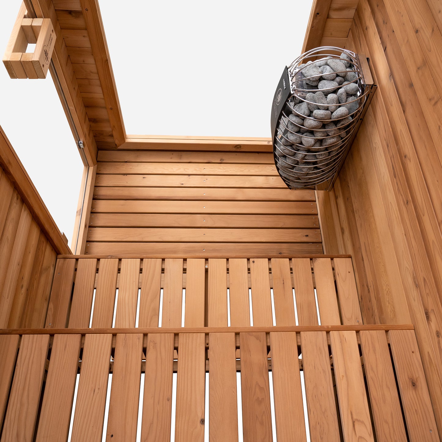 Redwood Outdoors Retreat 4 person indoor sauna, made of hemlock wood with a glass door and window view of interior from above