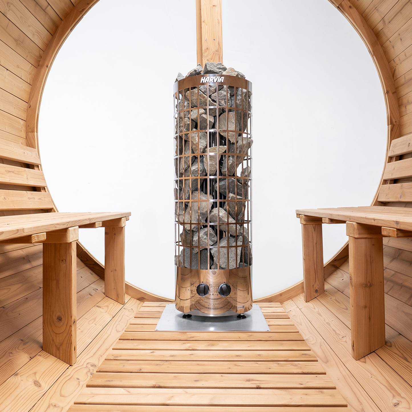 Redwood Outdoors Vista 6 person outdoor sauna, made of hemlock wood with a large glass rear window. A bench on both sides on the sauna and a heater towards the rear.