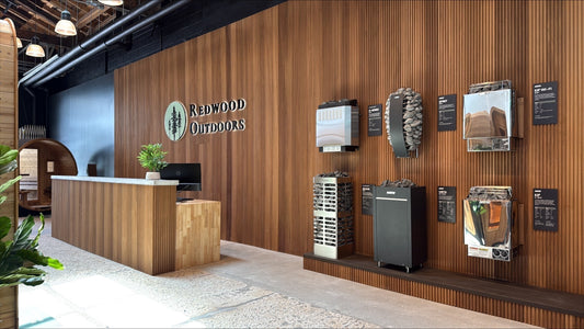 Heater wall at the Redwood Outdoors Salt Lake City showroom with six Harvia and Homecraft sauna heaters mounted side by side.