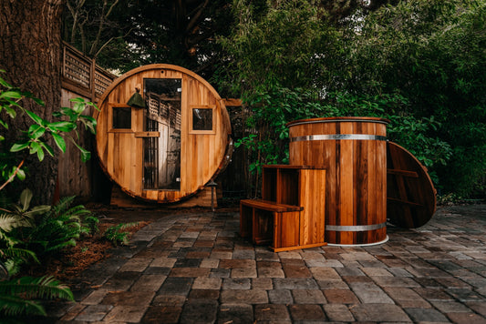 Redwood Outdoors barrel sauna and cold plunge tub side by side on a backyard deck