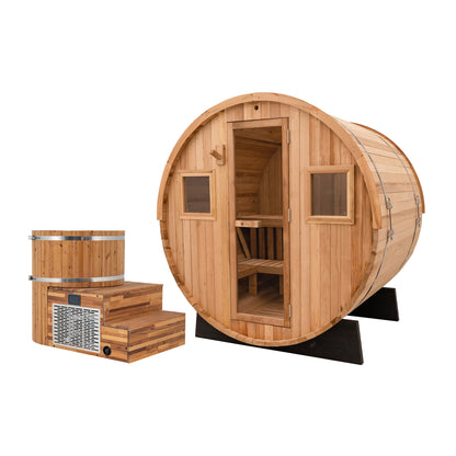 Redwood Outdoors Extra-Wide 6 person Barrel Sauna and Alaskan All-In-One cold plunge featured together at an angle, both made out of hemlock wood, with the sauna having a full glass door and two windows.