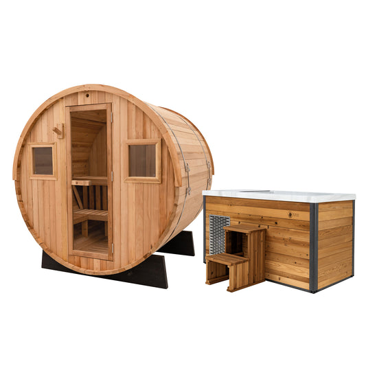 Redwood Outdoors Extra-Wide 6 person Barrel Sauna and Alaskan All-In-One cold plunge featured together at an angle, both made out of hemlock wood, with the sauna having a full glass door and two windows.