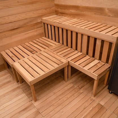 Redwood Outdoors 8 person ADA commercial sauna made of hemlock wood, interior view of 2 benches with a third movable bench placed next to the other benches.