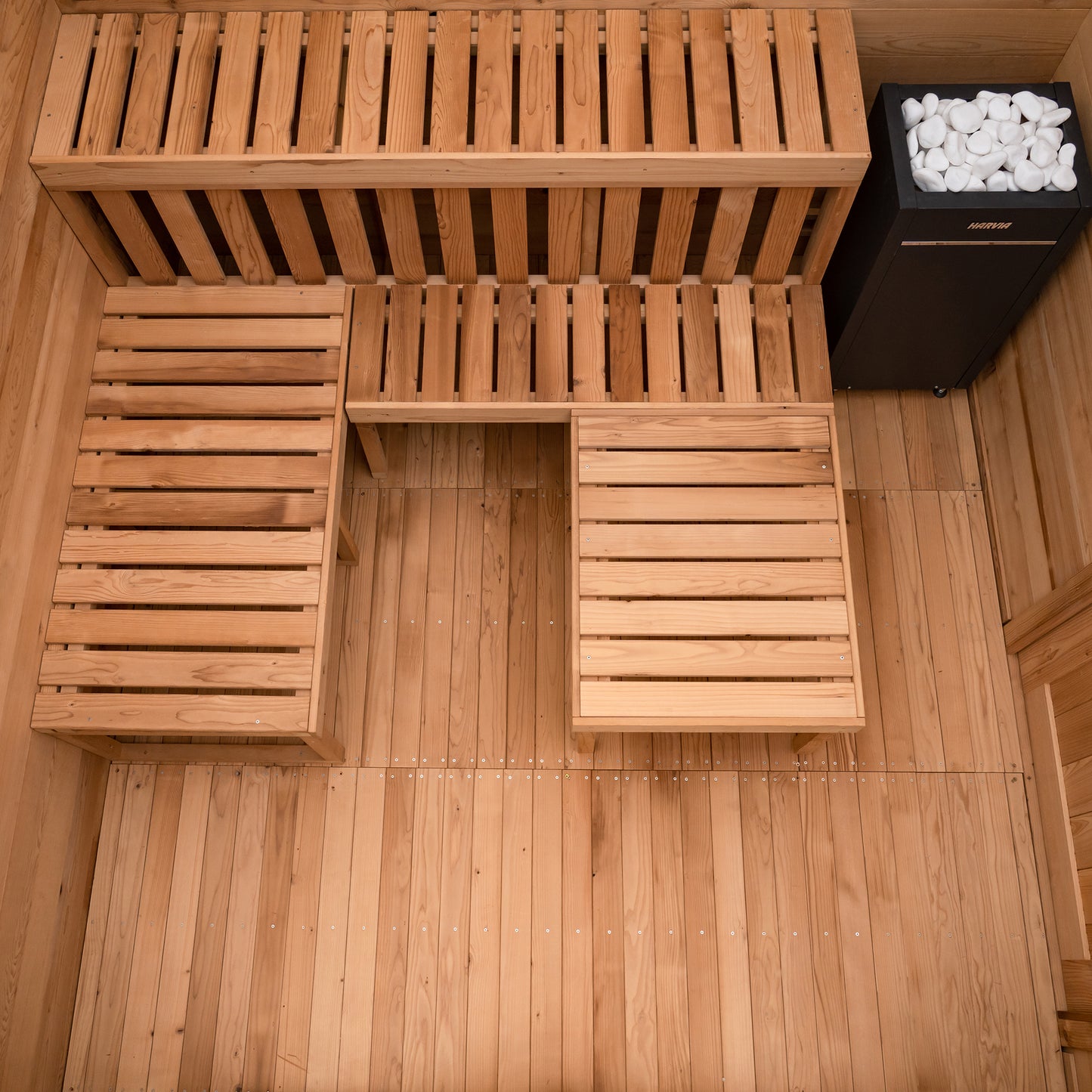 Redwood Outdoors 8 person ADA commercial sauna made of hemlock wood, interior view of 2 benches with a third movable bench placed next to the other benches.
