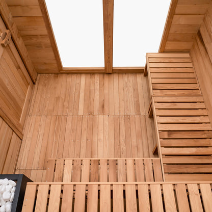 Redwood Outdoors 8 person ADA commercial sauna made of hemlock wood, interior view of 2 benches with a third movable bench placed along the wall.