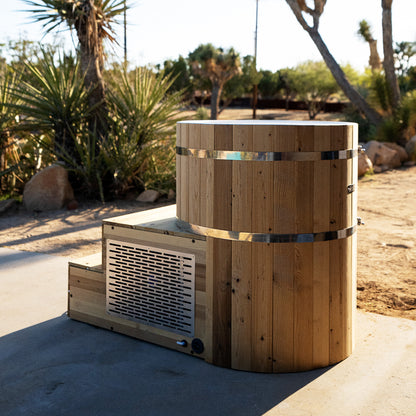 Redwood Outdoors Alaskan All-In_One Cold Plunge Tub made of heat treated wood exterior view with the lid off on a patio.