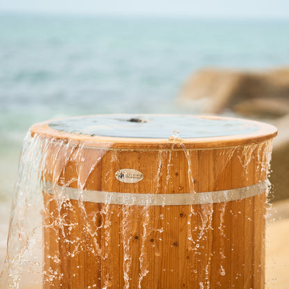 Redwood Outdoors Alaskan Cold Plunge Tub made of heat treated wood exterior view with the lid off over flowing with water.