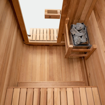 Redwood Outdoors Duo 2 person outdoor sauna, made of hemlock wood with a glass door interior view from the back of the sauna looking above