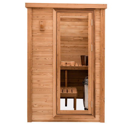 Redwood Outdoors Haven 3 person indoor sauna, made of hemlock wood with a glass door, exterior front view.