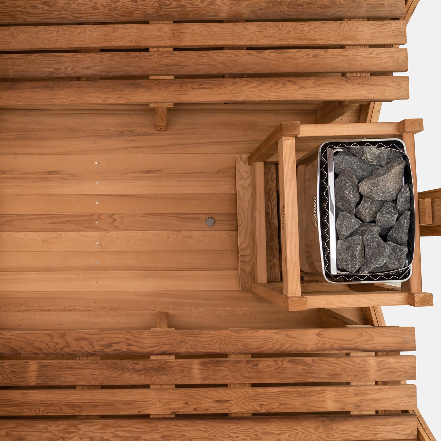 Redwood Outdoors Horizon 6 person outdoor sauna, made of hemlock wood with large rear window, heater with guard and two benches on both sides.