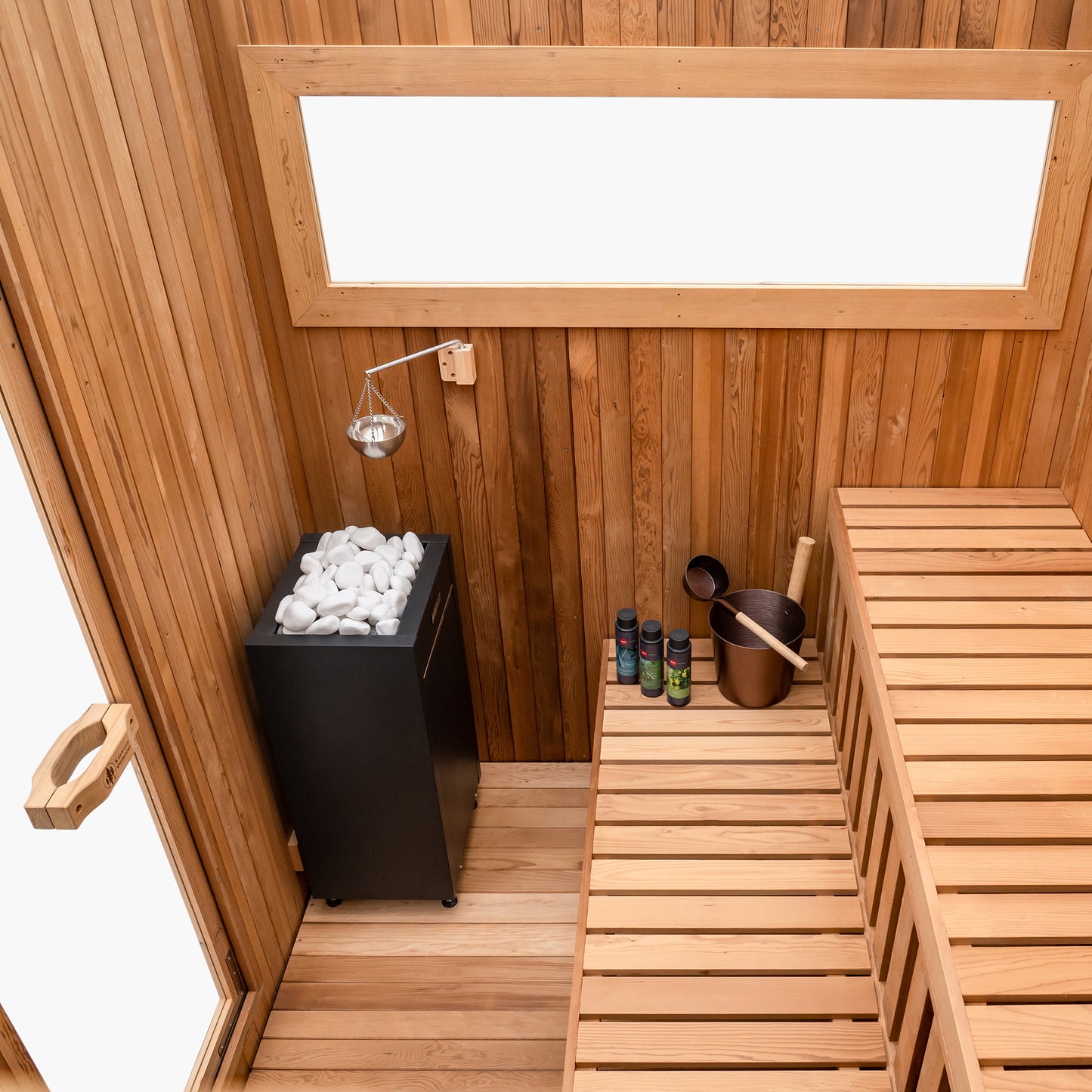Redwood Outdoors Noctra 8 person sauna, made of hemlock wood with a glass door and side window view from the side of the sauna. 