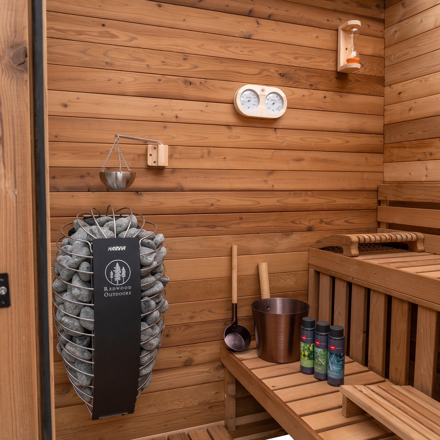 Redwood Outdoors Sanctuary 4 person indoor sauna, made of hemlock wood with a glass door interior view with accessories 