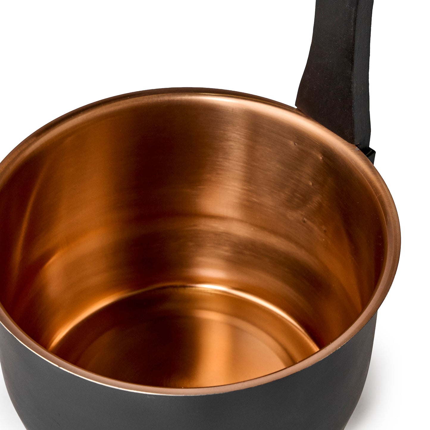 Black bucket with copper inside with a wooden handle interior view