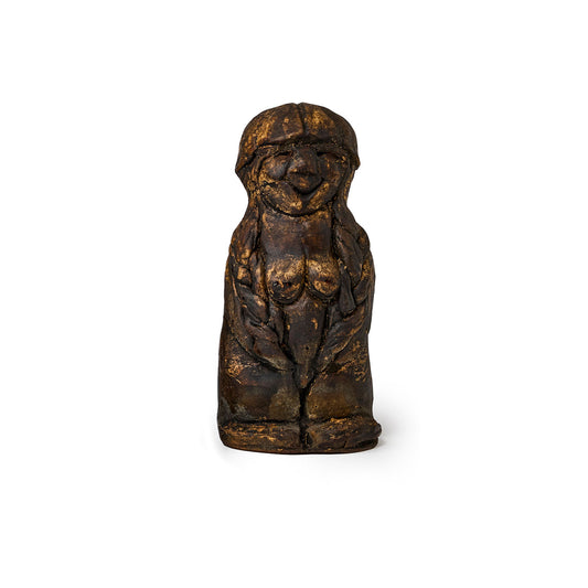 Small figure of an elf covered in pine tar front view