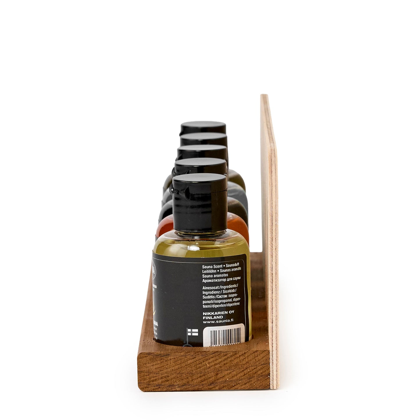 Wooden tray with five scent bottles aligned in a row, side view