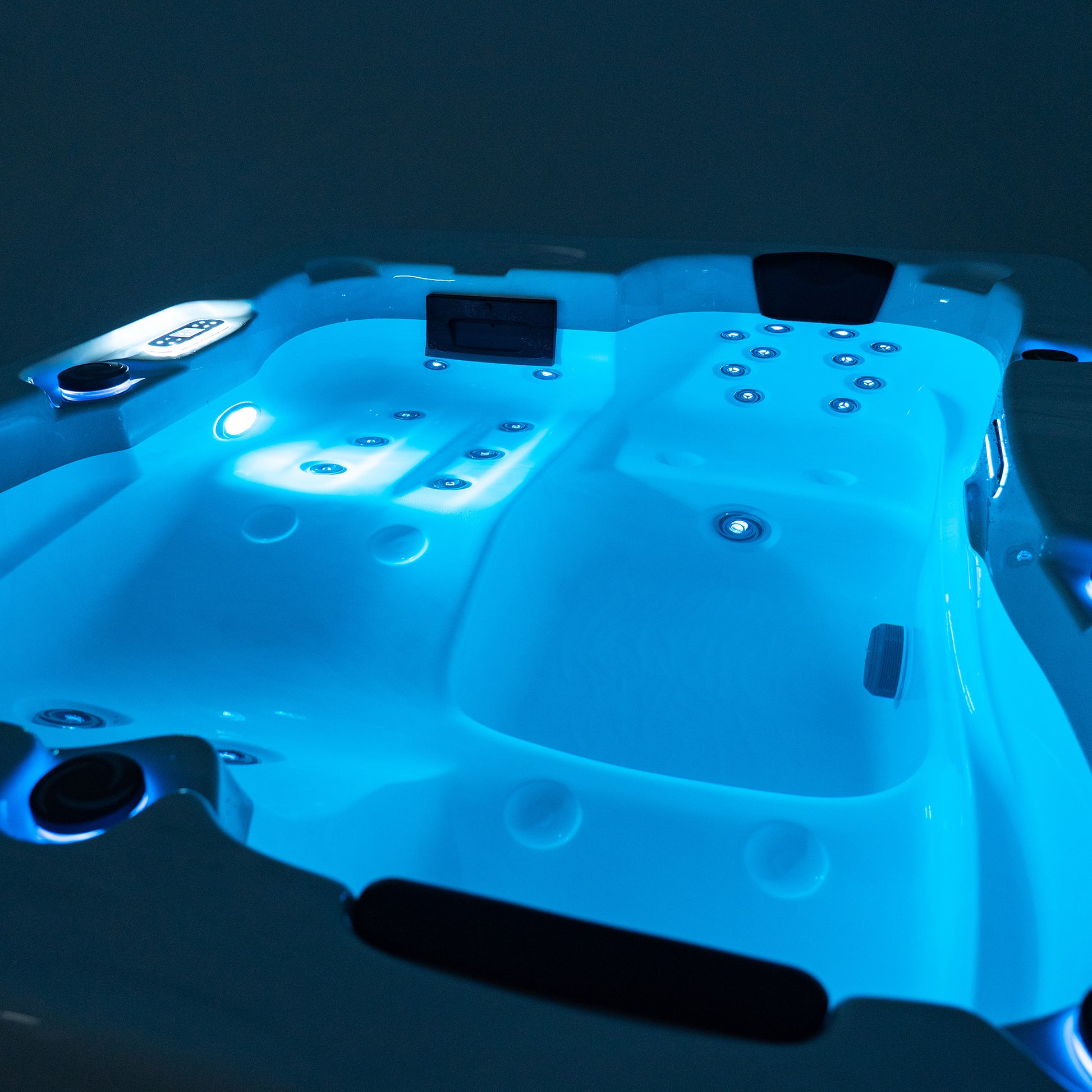 Redwood Outdoors Sequoia 3 person hot tub view of tub filled with water with the lights on