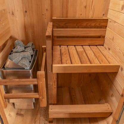 Redwood Outdoors Solo 1 person outdoor sauna, made of hemlock wood interior view of the bench and heater.