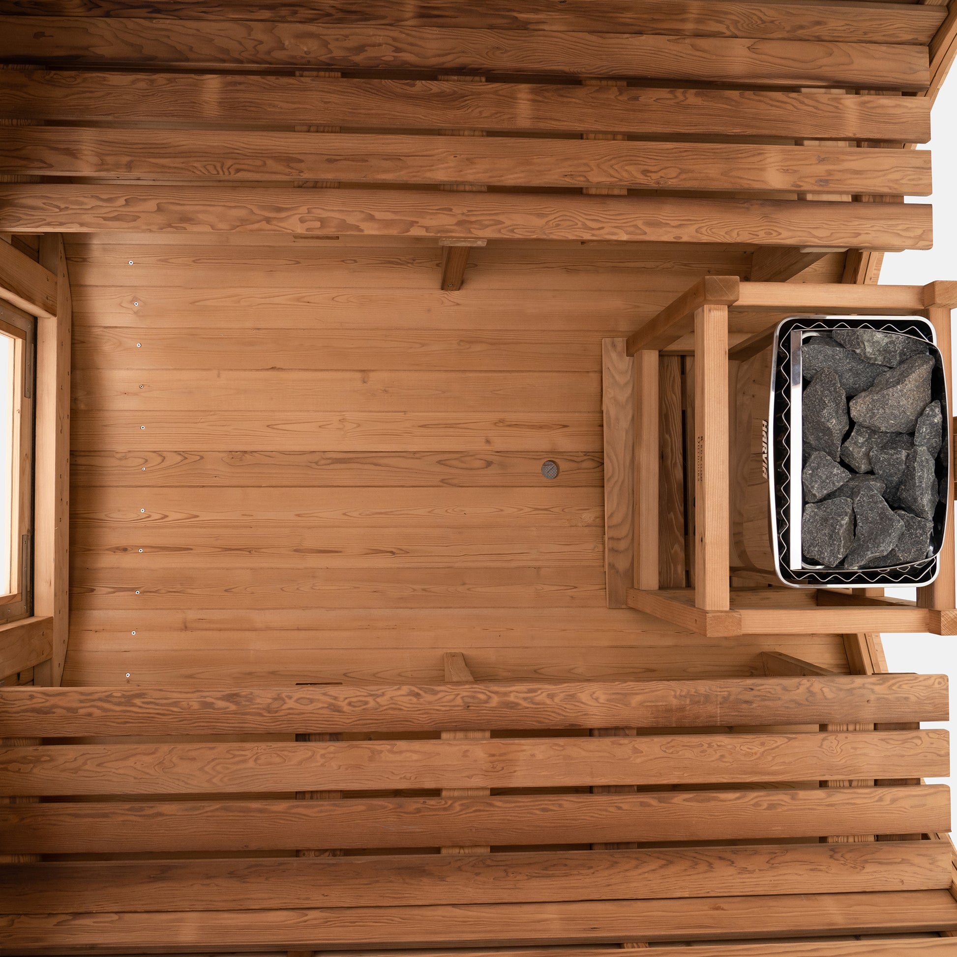 Redwood Outdoors Vista 6 person outdoor sauna, made of hemlock wood with large rear window, heater with guard and two benches on both sides.