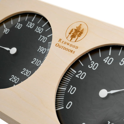 Pine thermometer and hygrometer combo, side by side with black dials and white lettering closeup view.
