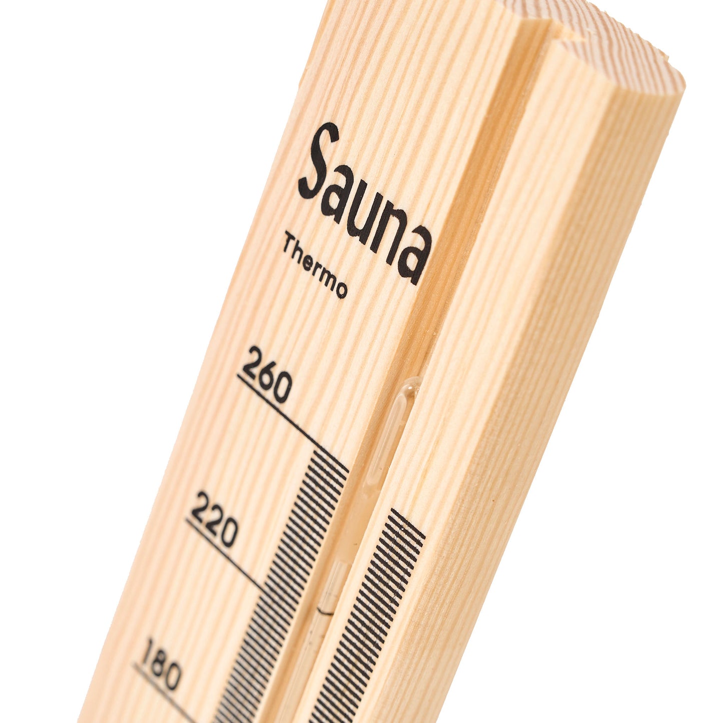 Pine wood sauna thermometer with black temperature markings close up view.