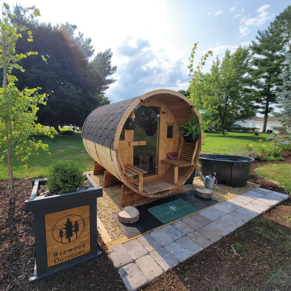 RedWood Outdoors Horizon 6 person outdoor barrel sauna with front porch and glass rear wall