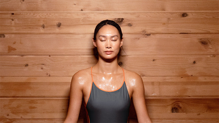 Woman relaxing in a sauna